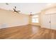 Bright living room featuring wood-look floors and ceiling fan at 245 Heronwood Cir, Deltona, FL 32725