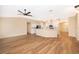 Open concept living room and kitchen with wood-look floors at 245 Heronwood Cir, Deltona, FL 32725