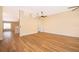 Spacious living room with wood-look floors and ceiling fans at 245 Heronwood Cir, Deltona, FL 32725