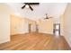 Spacious living room with wood-look floors and ceiling fans at 245 Heronwood Cir, Deltona, FL 32725