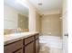 Bathroom with shower/tub combo, wood vanity, and tile flooring at 112 Augustus Pt, Sanford, FL 32773