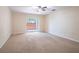 Spacious bedroom with carpet flooring and sliding glass door leading to a patio at 112 Augustus Pt, Sanford, FL 32773