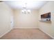 Dining room with chandelier and kitchen pass-through at 112 Augustus Pt, Sanford, FL 32773