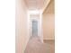 Simple hallway with carpeted flooring leading to other rooms at 112 Augustus Pt, Sanford, FL 32773