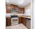 Stainless steel appliances and wood cabinets in kitchen at 112 Augustus Pt, Sanford, FL 32773