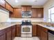 Kitchen with stainless steel appliances and granite counters at 112 Augustus Pt, Sanford, FL 32773