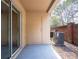 Private patio with brick wall and access to a storage room at 112 Augustus Pt, Sanford, FL 32773