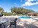 Community pool with lounge chairs and a covered patio area at 112 Augustus Pt, Sanford, FL 32773