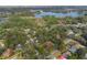 Aerial view showcasing home's location near lake at 117 E Goodheart Ave, Lake Mary, FL 32746