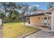 Landscaped backyard with patio and grassy area at 117 E Goodheart Ave, Lake Mary, FL 32746