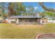 Screened porch and spacious backyard with grassy area at 117 E Goodheart Ave, Lake Mary, FL 32746