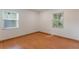 Spacious bedroom with wood floors and large windows at 117 E Goodheart Ave, Lake Mary, FL 32746