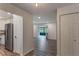 Bright entryway with wood-look floors and views to living room at 117 E Goodheart Ave, Lake Mary, FL 32746