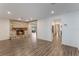 Living area featuring a stone fireplace and wood-look floors at 117 E Goodheart Ave, Lake Mary, FL 32746