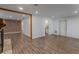 Living room with wood-look floors, fireplace and kitchen views at 117 E Goodheart Ave, Lake Mary, FL 32746