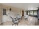 Relaxing screened porch with tiled floor and comfy seating at 117 E Goodheart Ave, Lake Mary, FL 32746