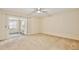 Bright bedroom with sliding door to a sunroom at 12340 Tavares Ridge Ln # 111, Tavares, FL 32778