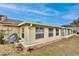 Light yellow vinyl-sided sunroom addition to home at 12340 Tavares Ridge Ln # 111, Tavares, FL 32778