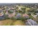 Aerial view of a house in a golf course community at 1395 Legendary Blvd, Clermont, FL 34711