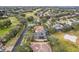 Expansive aerial view of a house and surrounding golf course community at 1395 Legendary Blvd, Clermont, FL 34711