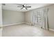 Bright bedroom with tile floors and ceiling fan at 1395 Legendary Blvd, Clermont, FL 34711