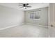 Bright bedroom with ceiling fan and tile flooring at 1395 Legendary Blvd, Clermont, FL 34711