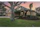 Two-story house with a three-car garage and landscaped yard at 1395 Legendary Blvd, Clermont, FL 34711