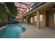 Inviting pool area with covered patio and lighting at 1395 Legendary Blvd, Clermont, FL 34711