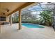 Screened pool and patio area with ceiling fans at 1395 Legendary Blvd, Clermont, FL 34711