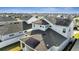 Aerial view of a house with solar panels on the roof and a gray roof at 14789 Milfoil Ave, Orlando, FL 32827