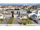 Aerial view of a two-story house with solar panels, a gray roof, and a gray exterior at 14789 Milfoil Ave, Orlando, FL 32827