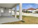 Covered backyard patio with concrete flooring and a view of the yard at 14789 Milfoil Ave, Orlando, FL 32827