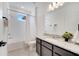 Bathroom with granite counters, shower-tub combo, and ceramic tile flooring at 14789 Milfoil Ave, Orlando, FL 32827