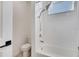 Bright bathroom featuring a modern tub-shower with sleek, white tile and contemporary fixtures at 14789 Milfoil Ave, Orlando, FL 32827