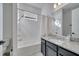 Bathroom with a shower/tub combo and granite countertop at 14789 Milfoil Ave, Orlando, FL 32827