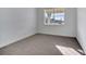 Bright bedroom featuring neutral carpeting and a window at 14789 Milfoil Ave, Orlando, FL 32827