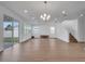 Bright dining room with wood-look floors and chandelier at 14789 Milfoil Ave, Orlando, FL 32827