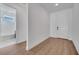 Clean entryway with wood-look floors and a view of the bathroom at 14789 Milfoil Ave, Orlando, FL 32827