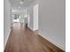 Spacious hallway with wood-look floors, leading to other rooms at 14789 Milfoil Ave, Orlando, FL 32827