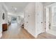 Bright, inviting hallway leads into an open-concept living space and showcases a modern bathroom at 14789 Milfoil Ave, Orlando, FL 32827