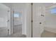 Bright hallway with doors leading to bedrooms and bathroom at 14789 Milfoil Ave, Orlando, FL 32827