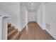 Clean hallway with wood-look floors and staircase at 14789 Milfoil Ave, Orlando, FL 32827