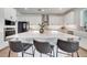 Beautiful kitchen with a large island, quartz countertops, stainless appliances, and stylish bar stool seating at 14789 Milfoil Ave, Orlando, FL 32827