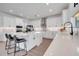 Bright and airy kitchen with a center island, stainless steel appliances, and quartz countertops at 14789 Milfoil Ave, Orlando, FL 32827