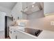 Modern kitchen featuring stainless steel appliances, white cabinets, and quartz countertops at 14789 Milfoil Ave, Orlando, FL 32827