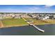 Scenic view of the lake with a fishing pier and the neighborhood pool in the distance at 14789 Milfoil Ave, Orlando, FL 32827