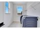 Bright laundry room featuring a window and modern washer and dryer at 14789 Milfoil Ave, Orlando, FL 32827