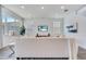 Cozy living room with a comfortable sofa, stylish decor, and bright natural light flooding through the windows at 14789 Milfoil Ave, Orlando, FL 32827