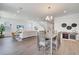 Open floor plan with a dining area, living space, and staircase, creating a modern and inviting atmosphere at 14789 Milfoil Ave, Orlando, FL 32827