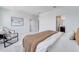 Bright main bedroom featuring neutral walls, carpet, and access to an ensuite bathroom at 14789 Milfoil Ave, Orlando, FL 32827